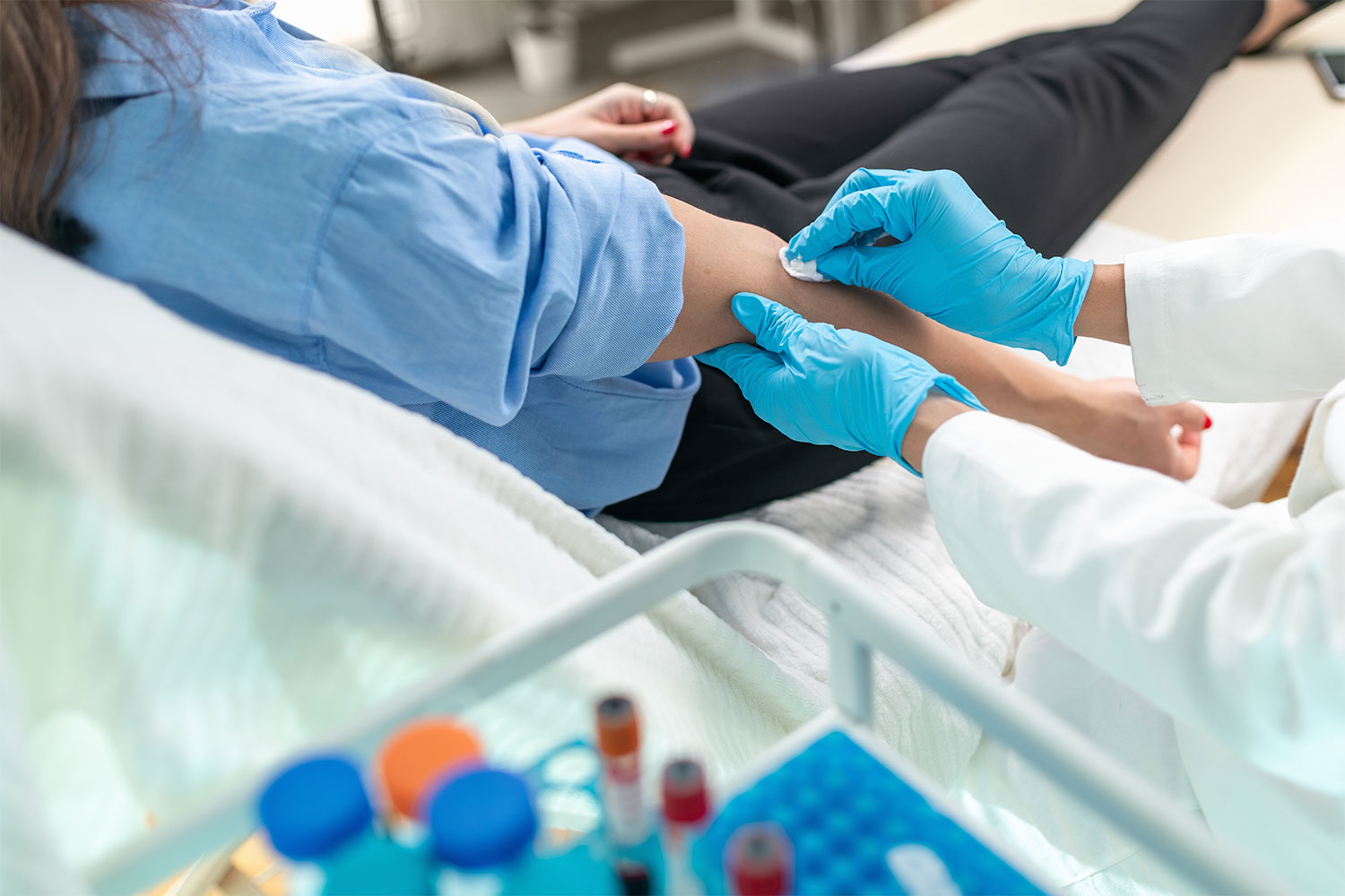 healthcare worker drawing blood from a patient in utc